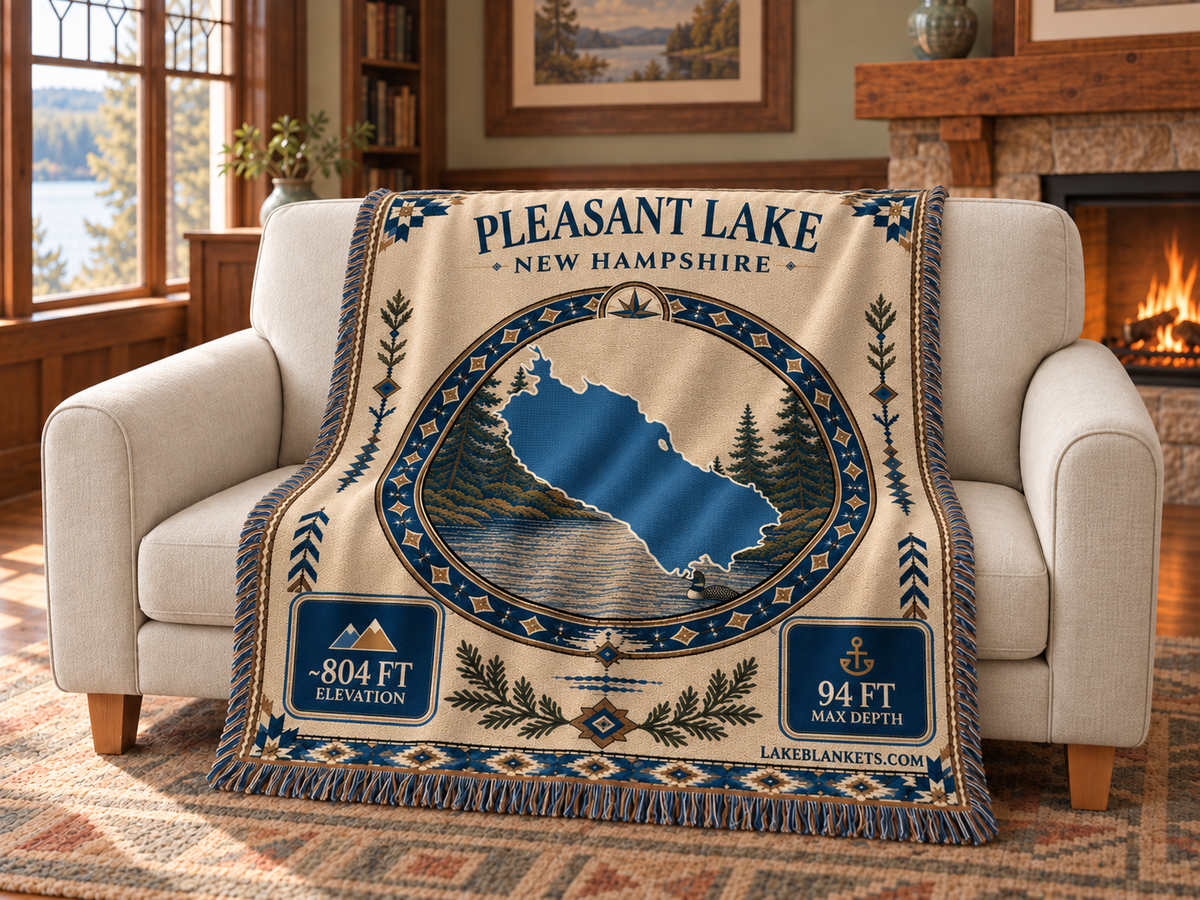 Pleasant Lake (New London) Woven Landmark Medallion blanket draped over a couch