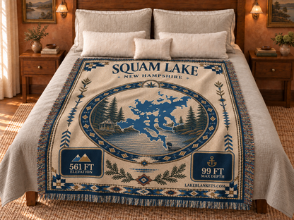 Squam Lake Woven Landmark Medallion blanket displayed on a bed